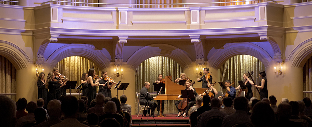 A group of classical musicians on stage
