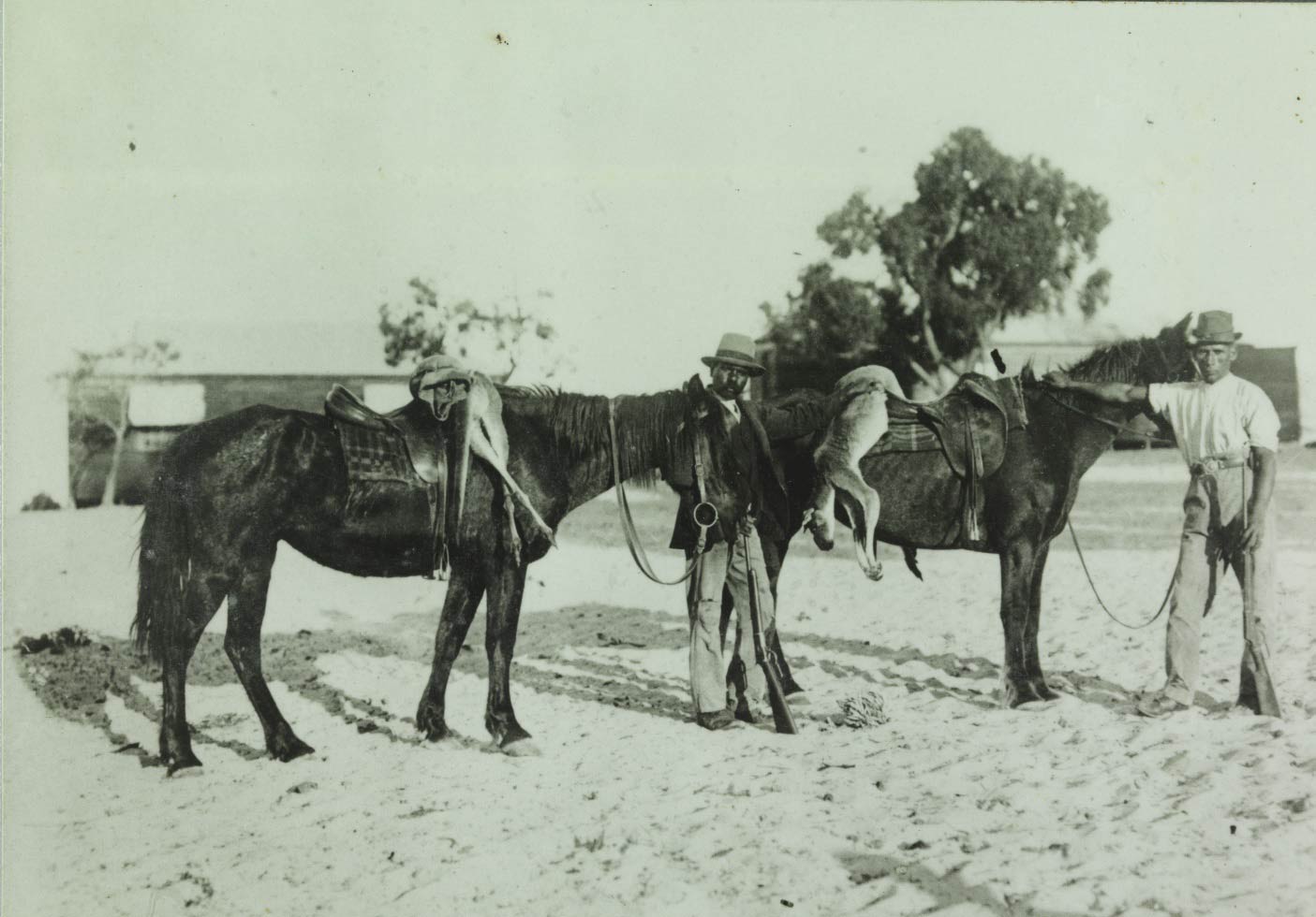 Moore River Native Settlement two horseman with kangaroos