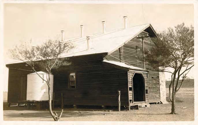 An old sepia toned photograph of the school