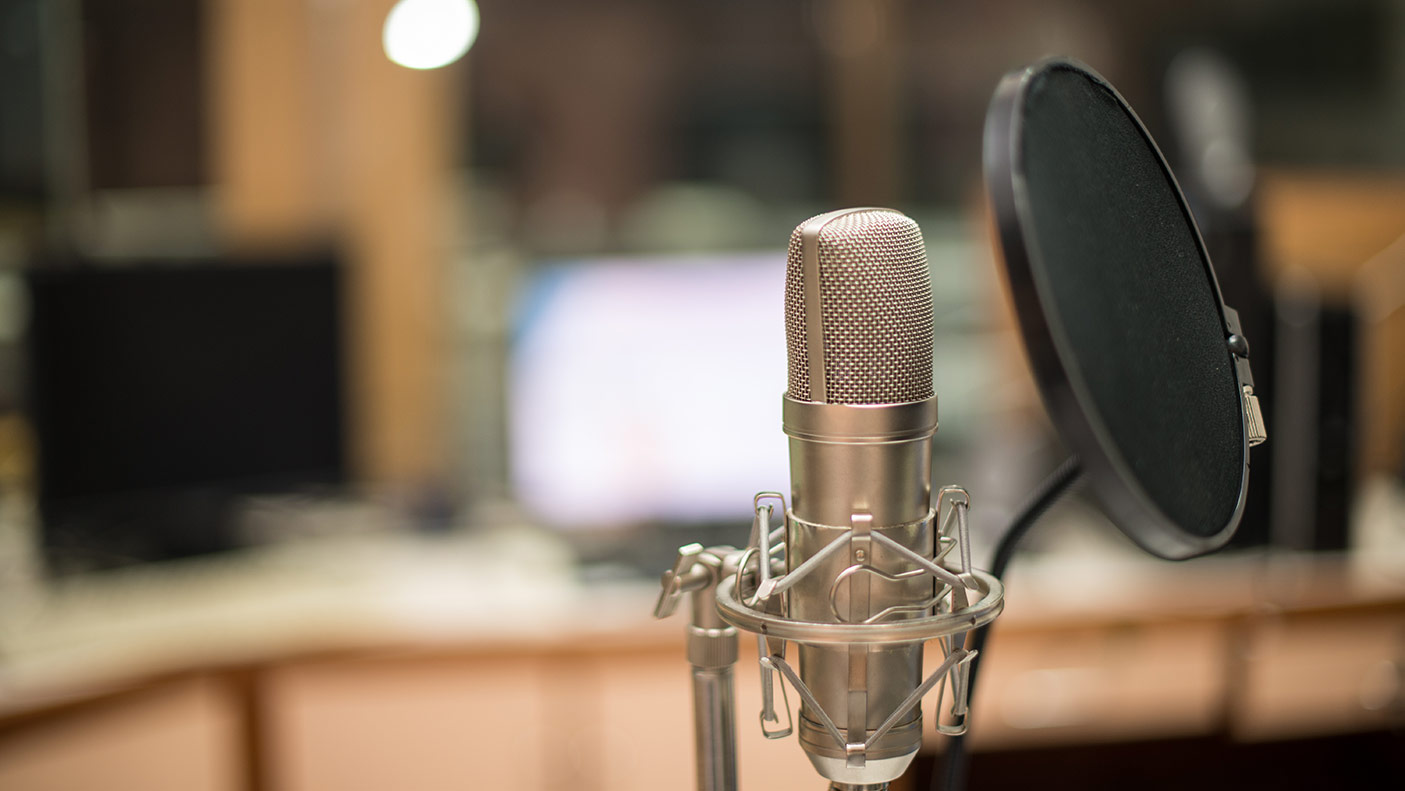 Close up photo of a microphone in a recording studio