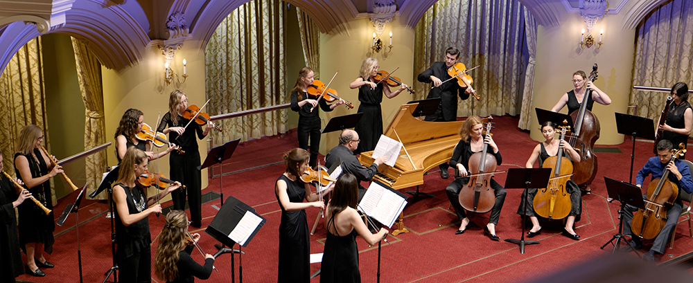 A group of classical musicians on stage