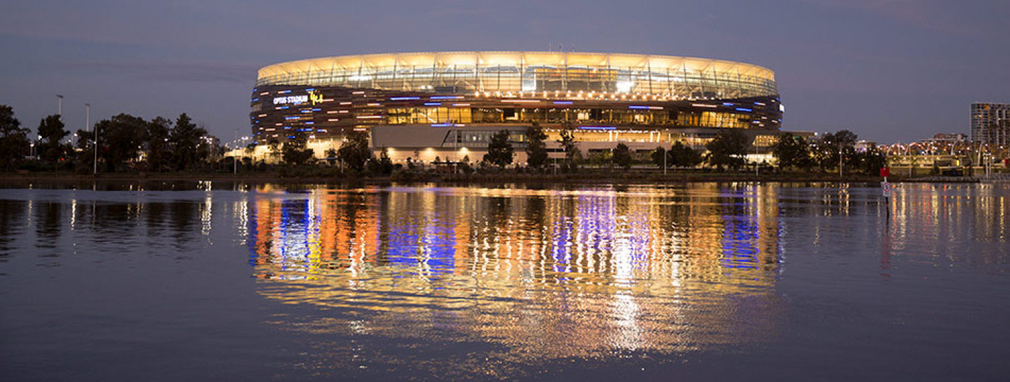 Optus Stadium view from the Swan River at twilight.
