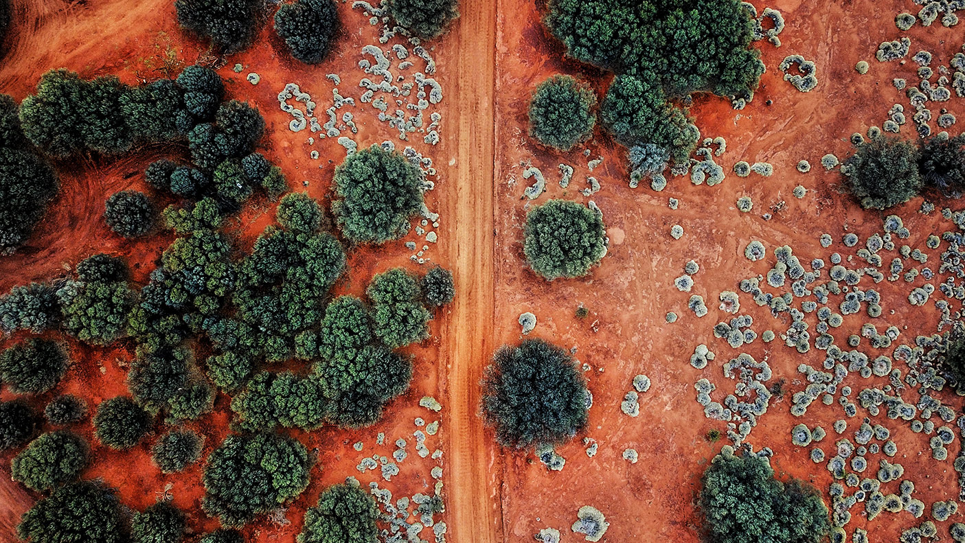 An Aerial shot of the red centre roads in the Australian Outback - stock photo