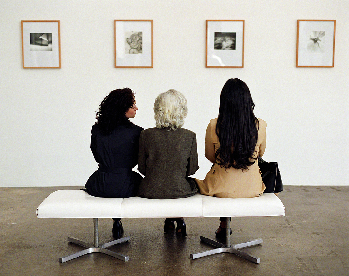 art gallery visitors looking at paintings