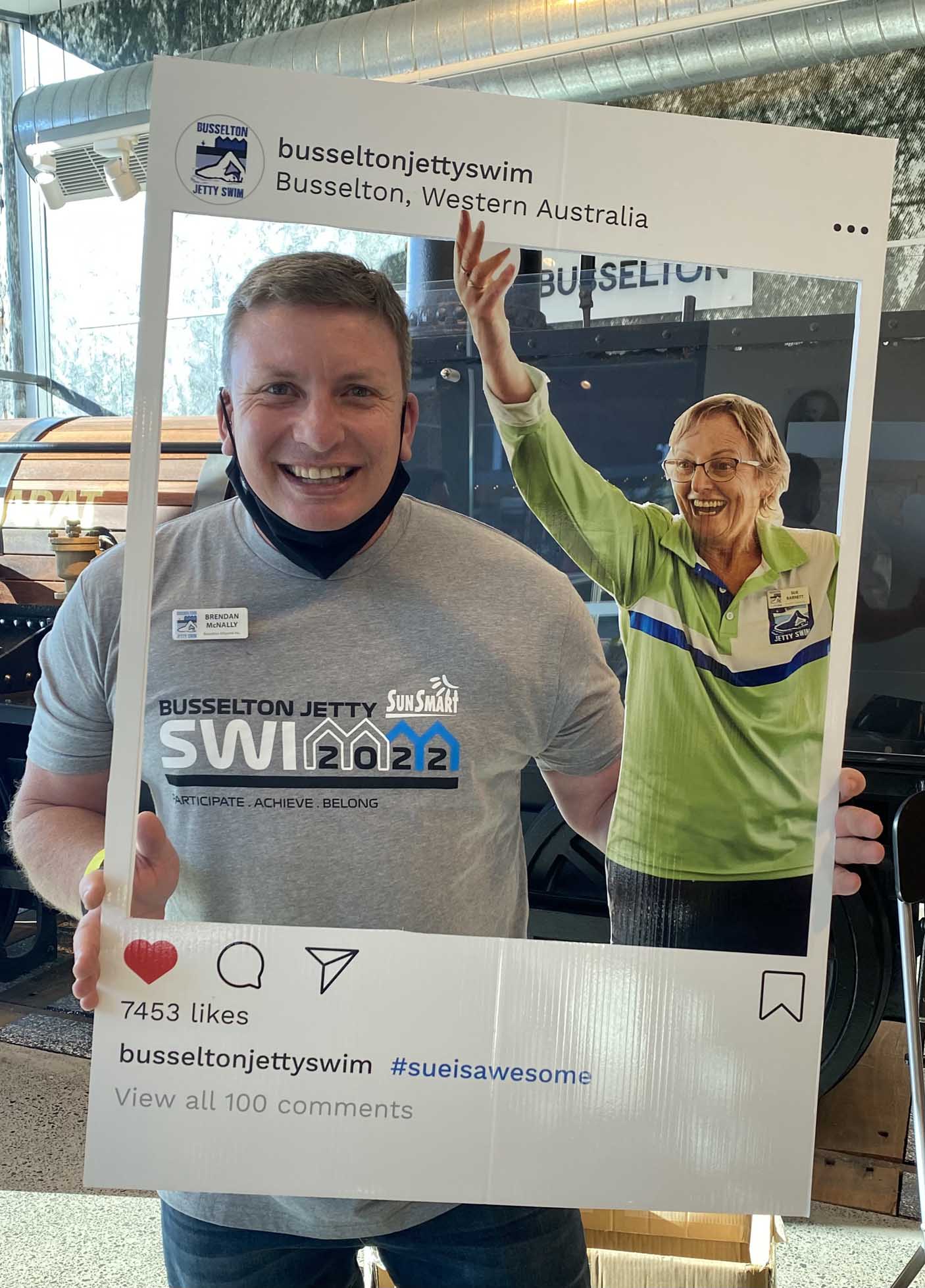 Brendan McNally with a cardboard Busselton Jetty Swim social media frame