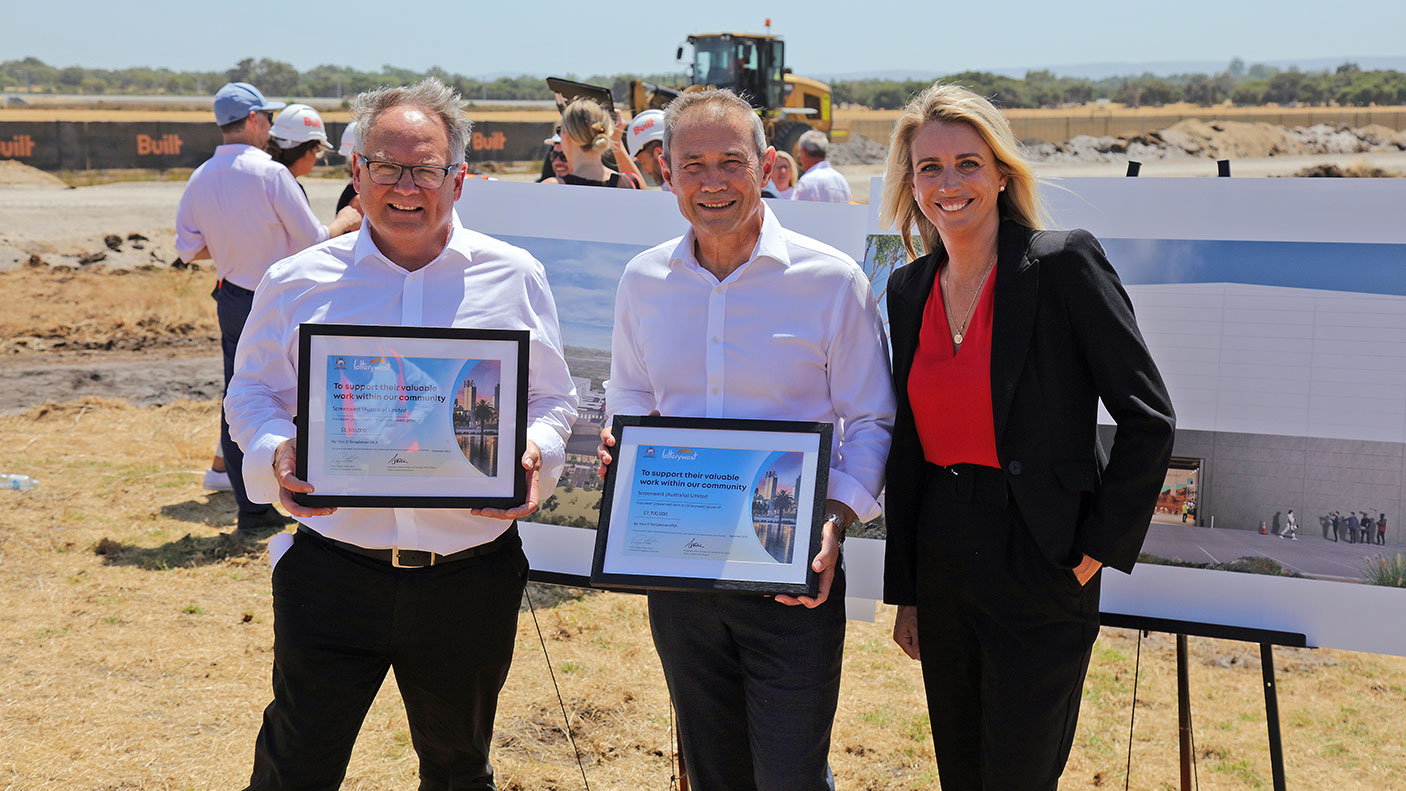 Premier of Western Australia, and Minister for Culture and the Arts presenting two Lotterywest grant certificates to the CEO of Screenwest at the construction site that will house the state’s new screen production facility