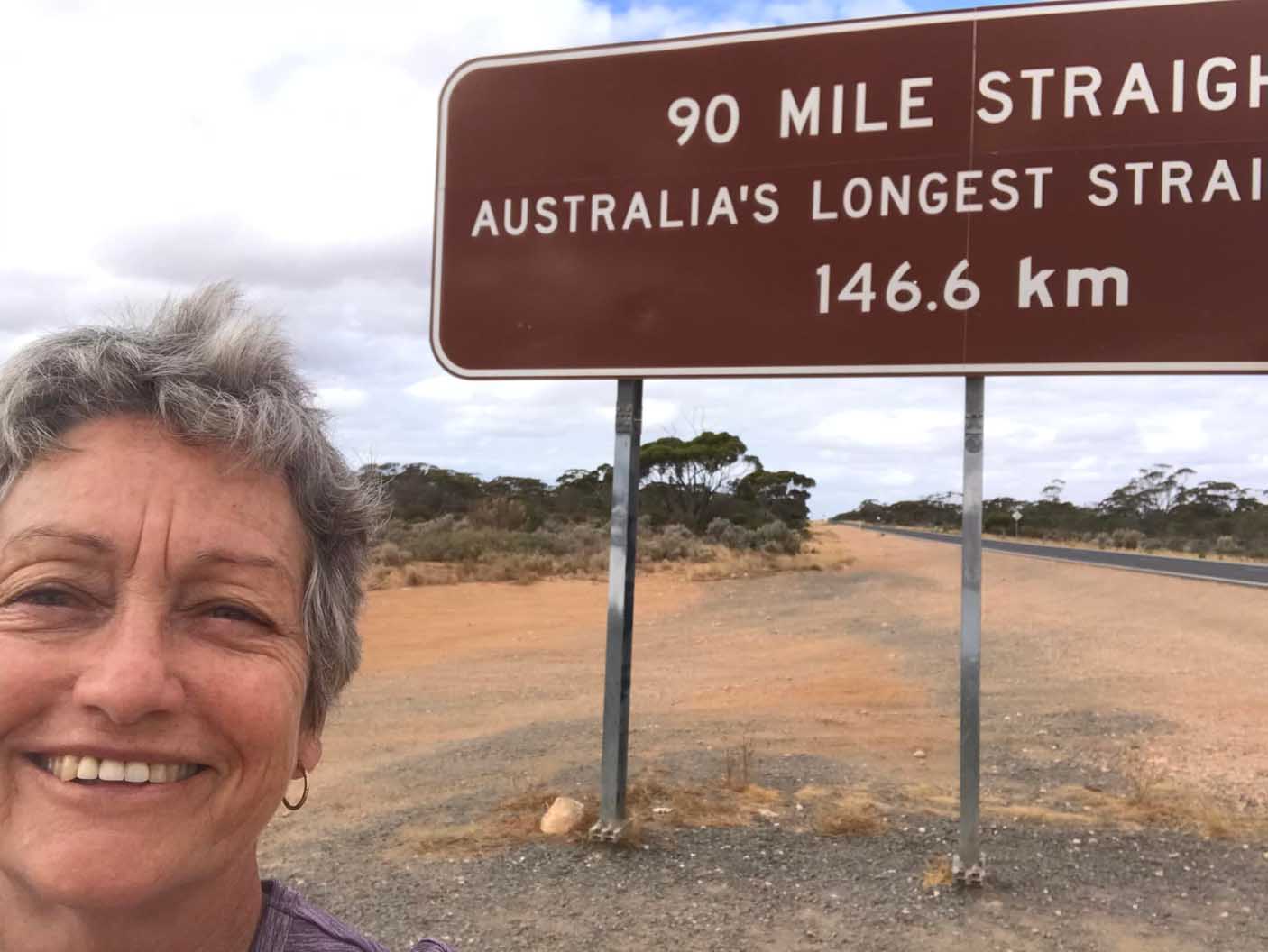 Pam Glossop in front of sign