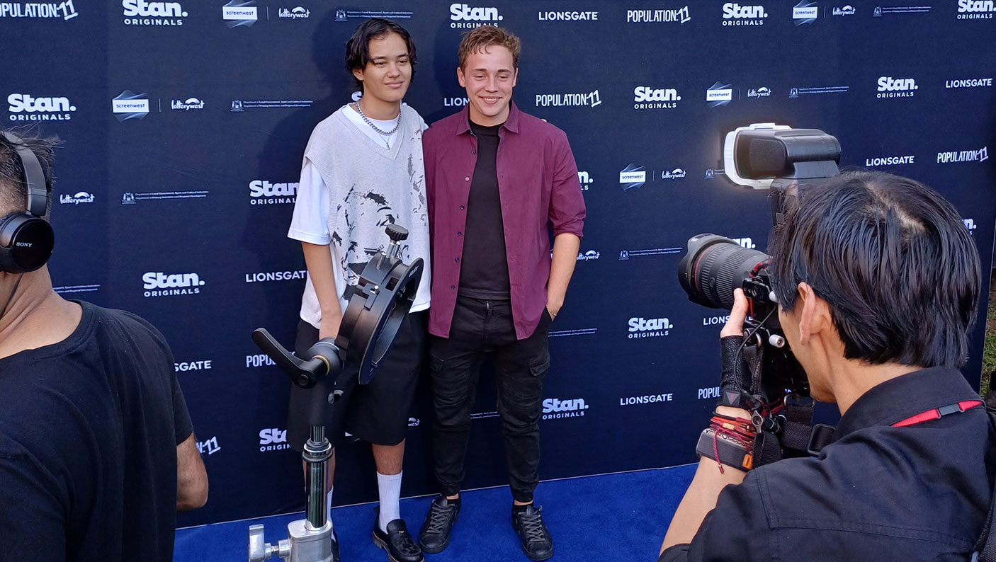 Tyroe Muhafidin and Lee Tiger Halley on blue carpet at the Premiere of Population: 11