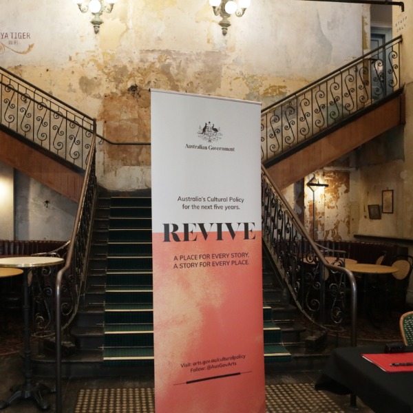 A banner for Revive in front of historic staircase. Image Australian Government Office for the Arts.