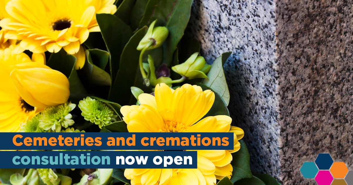 Flowers on a gravestone with the words, 'Cemeteries and cremations consultation now open'