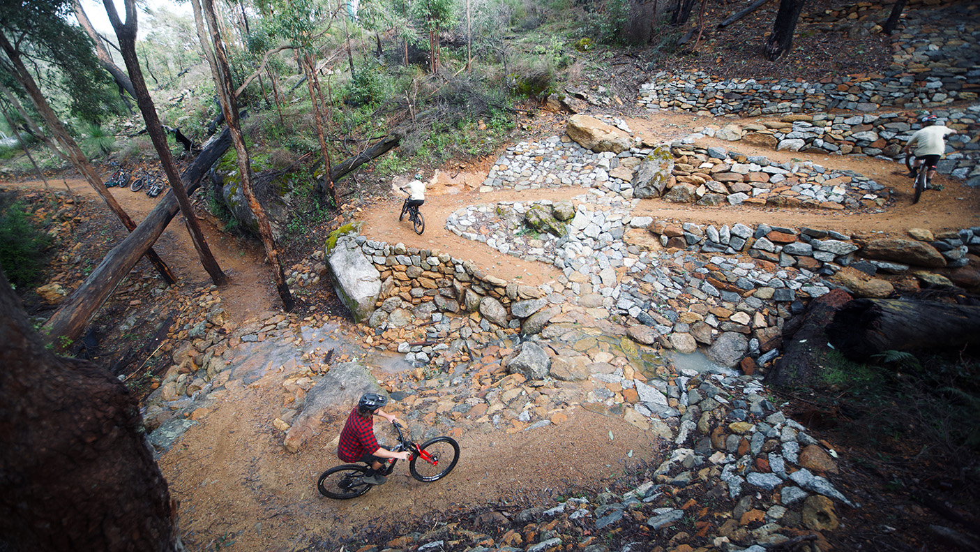 Two mountain bike riders on a trail in a National Park