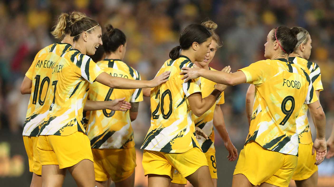 Sam Kerr of the Australian Matildas is congratulated by team mates after scoring a goal during the Women's Olympic Football Tournament Play-Off