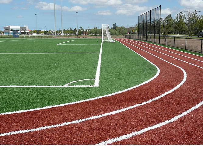 Synthetic soccer pitch and community school level athletics track