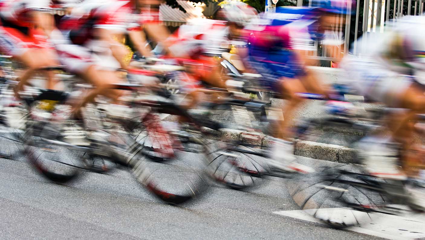 Blurred image of cyclers in a street race