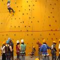 Participants using an indoor climbing wall