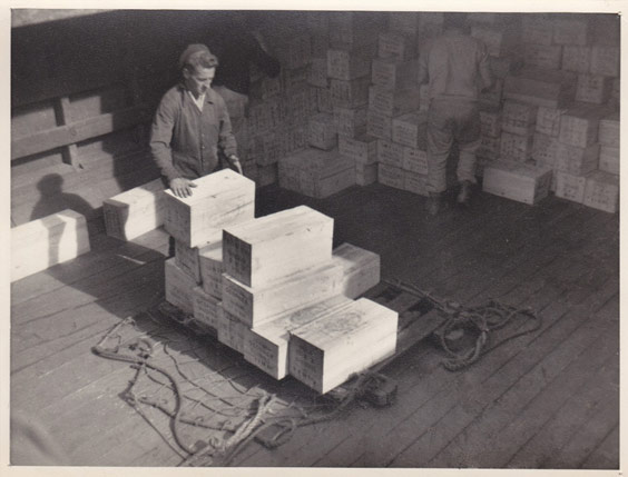 A man moving boxes of explosives