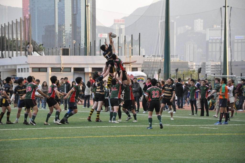 Rugby being played overseas on a synthetic turf field