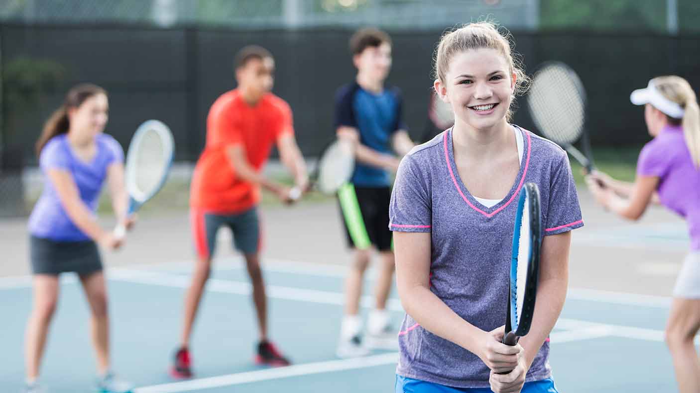 Teenagers at tennis clinic